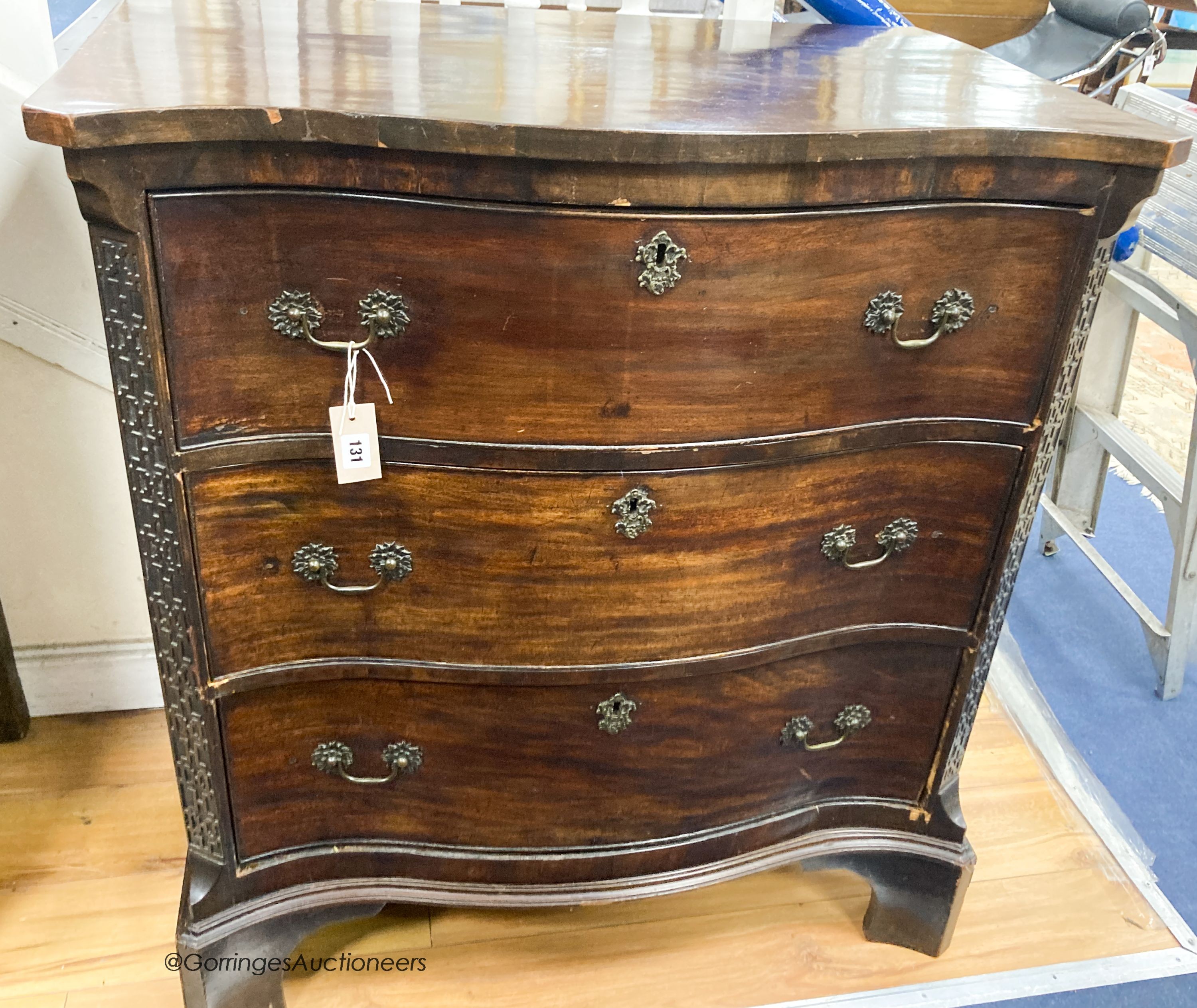A George III style mahogany serpentine secretaire chest, width 87cm, depth 56cm, height 96cm